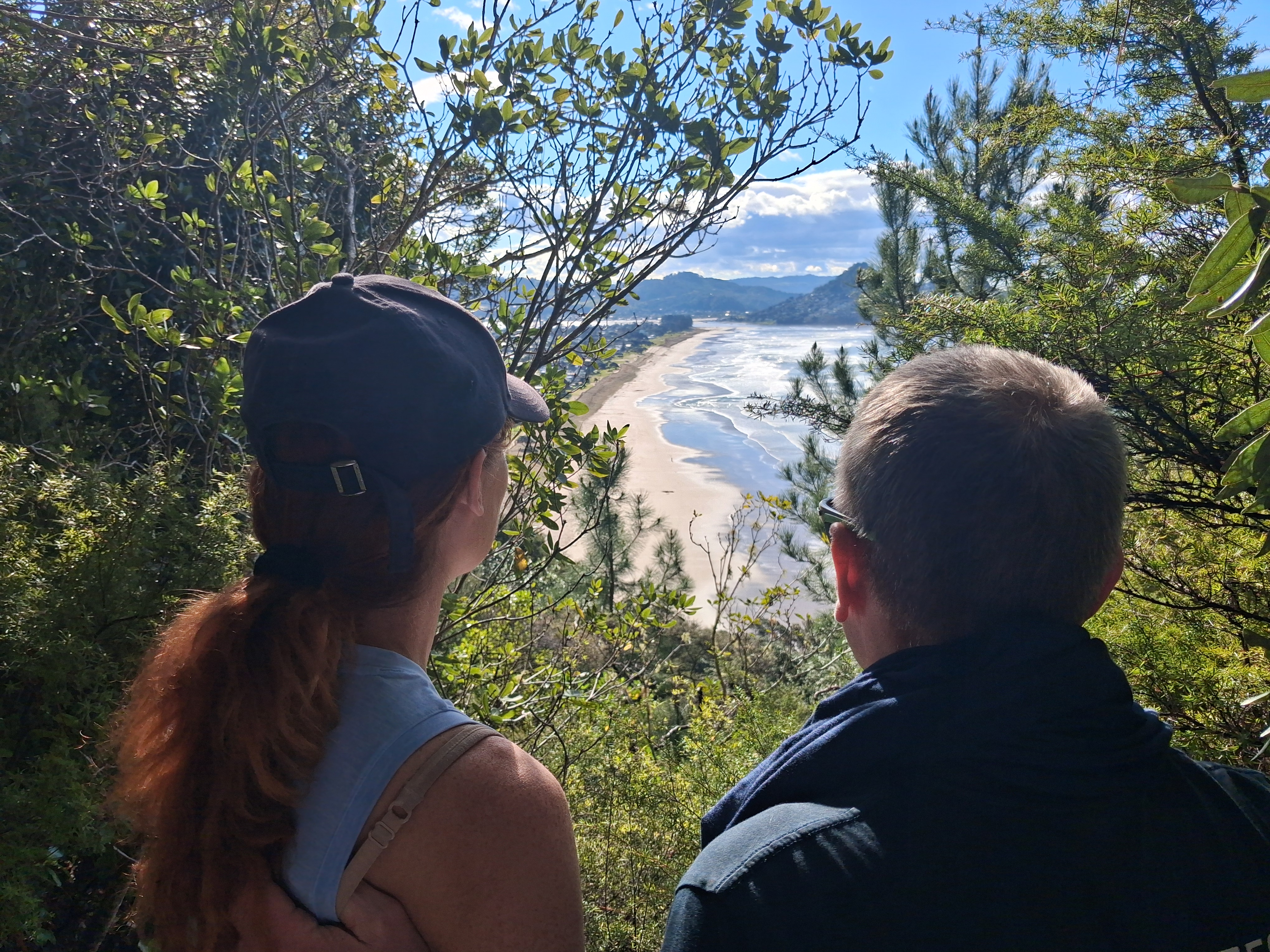 Couple looking at beach Coromandel
