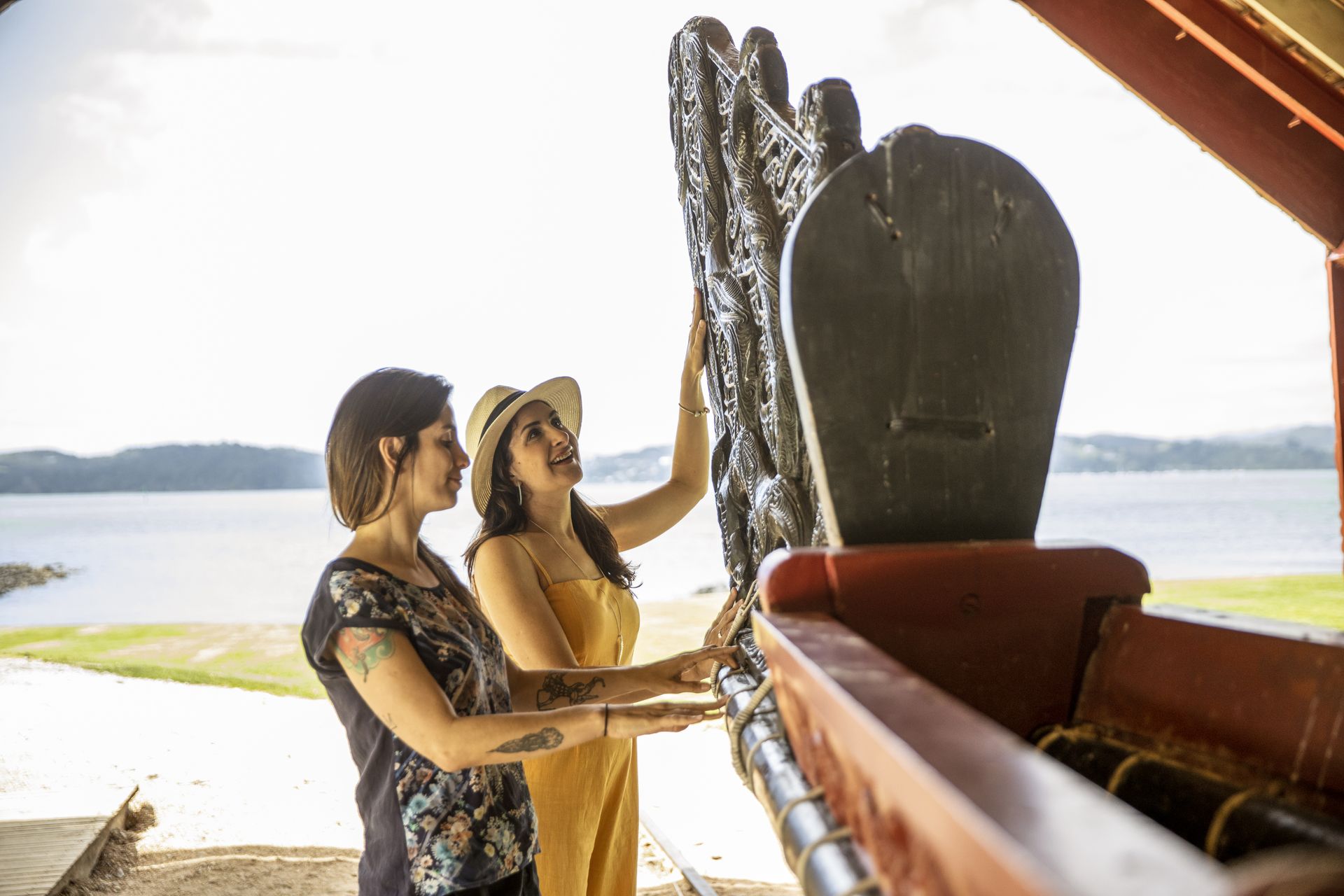 Women looking at Maori waka